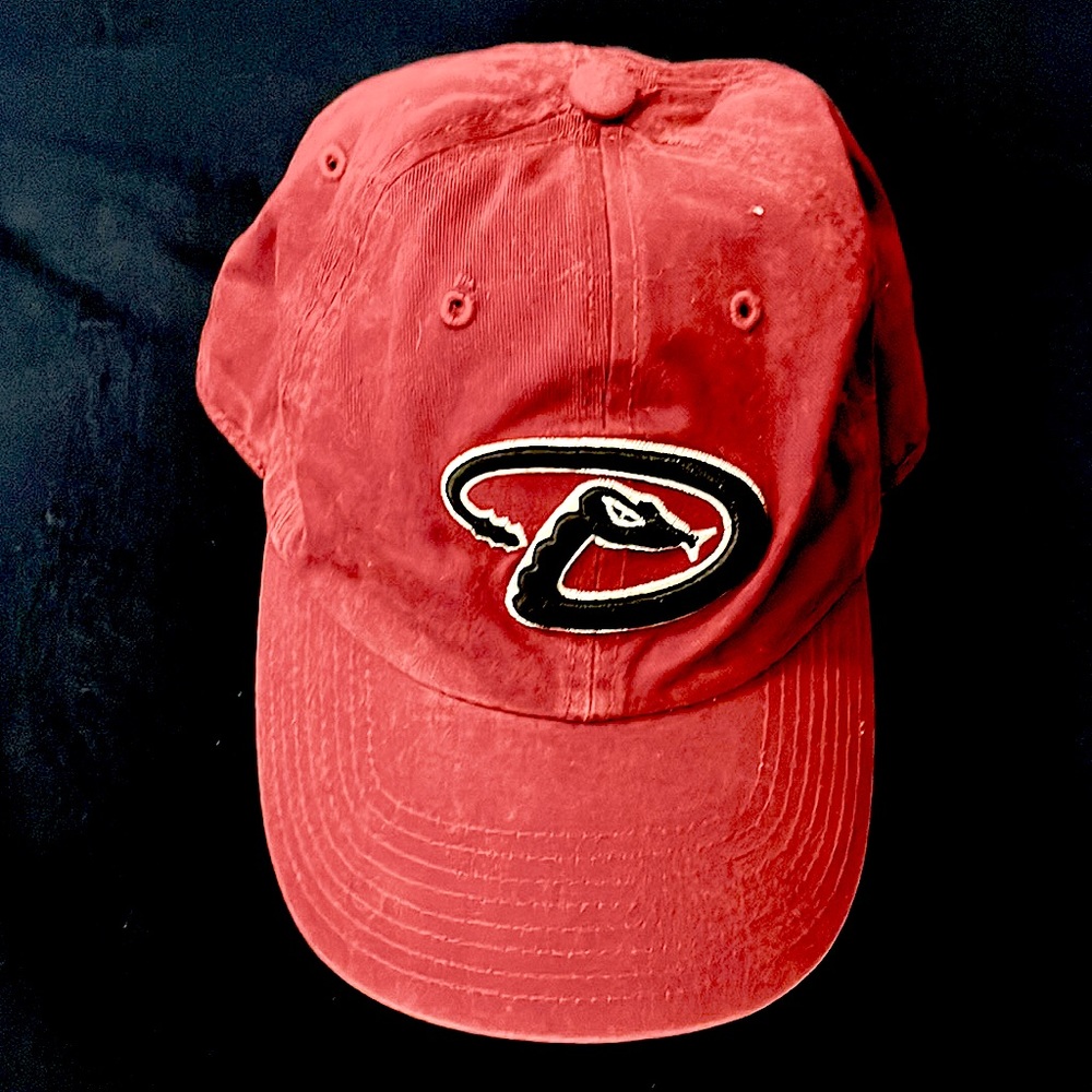 Small diamondbacks hat. More of a maroon color